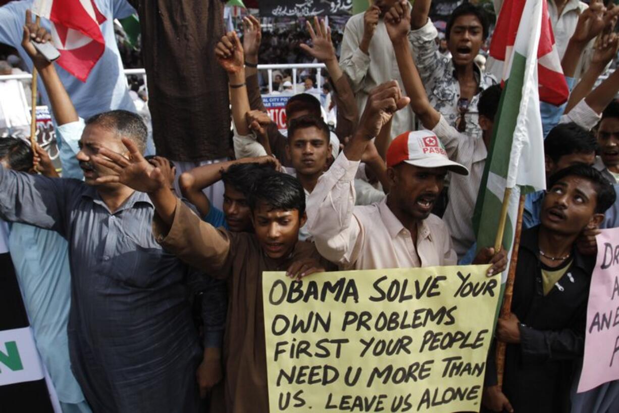 People rally to condemn the killing of Osama bin Laden in Karachi, Pakistan on Tuesday. Bin Laden, the mastermind behind the Sept.