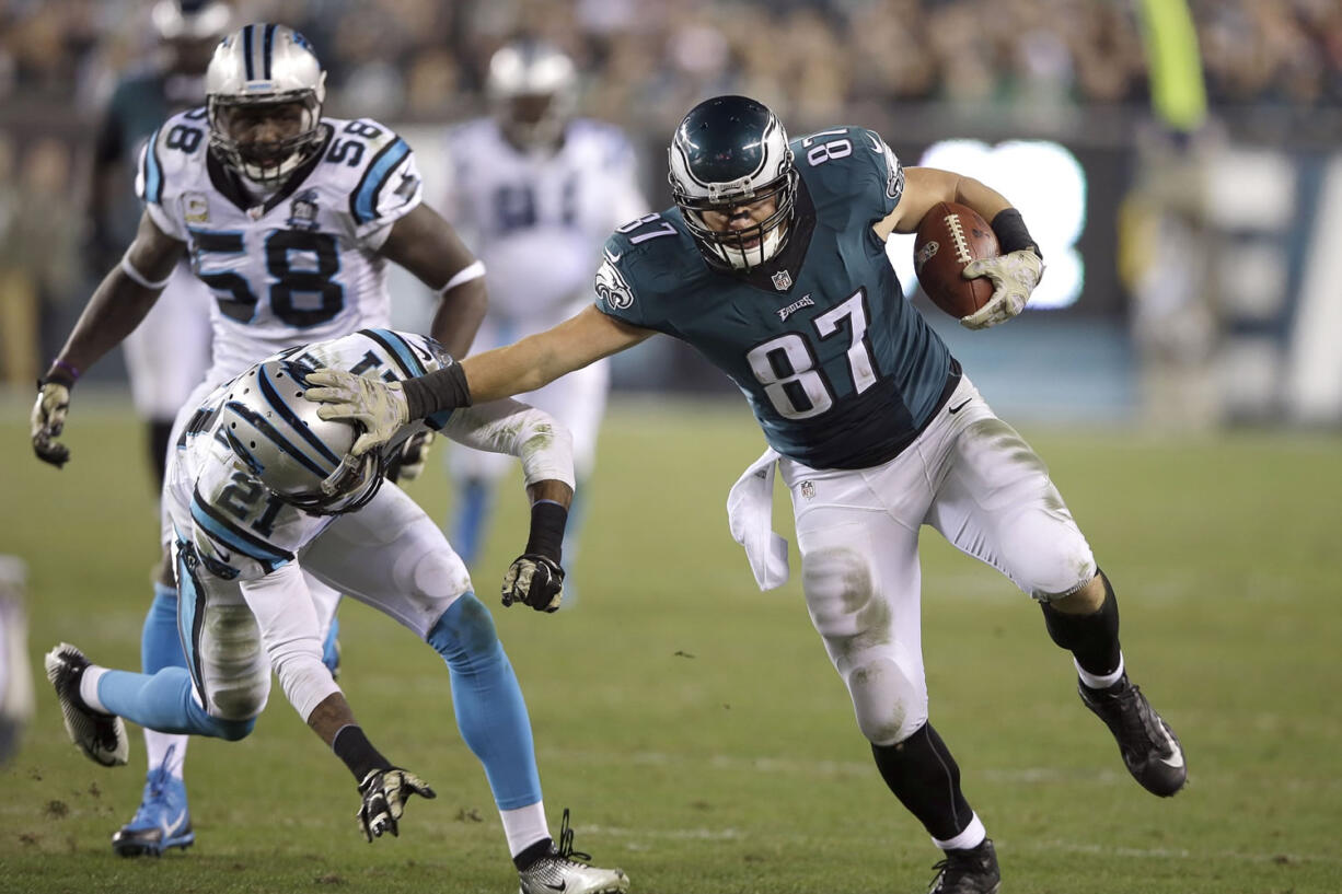 Philadelphia Eagles' Brent Celek (87) tries to break a tackle by Carolina Panthers' Thomas DeCoud (21) during the second half Monday, Nov. 10, 2014, in Philadelphia.