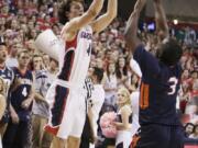 Gonzaga's Kevin Pangos (4) shoots against Pepperdine's Jeremy Major (3) during the first half Saturday, Feb. 14, 2015, in Spokane.