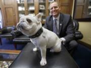 U.S. Rep. Jeff Denham, R-Calif., poses with Lily, his 15-pound French bulldog, in his office on Capitol Hill in Washington.