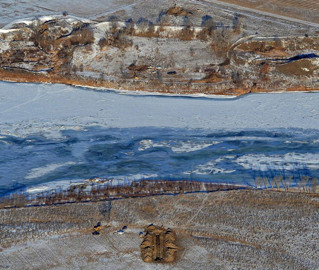 Crews work on Jan. 19 to contain an oil spill from Bridger Pipeline's broken pipeline near Glendive, Mont. Oil pipeline accidents have spiked in the U.S.