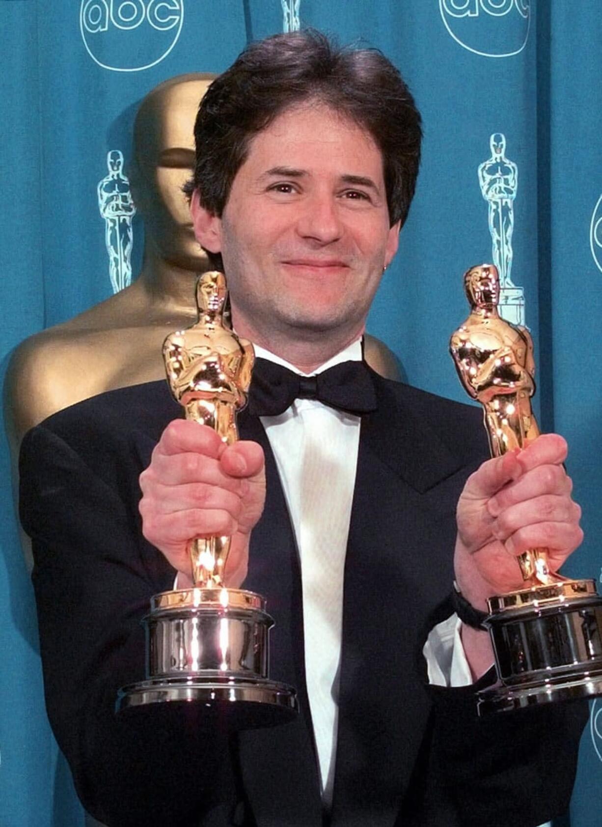 Composer James Horner displays Oscars he won for Original Song and Original Dramatic Score for &quot;Titanic&quot; at the 70th Academy Awards on March 23, 1998, at the Shrine Auditorium in Los Angeles. Horner's agent says the Oscar-winning &quot;Titanic&quot; composer was the pilot who died in a Southern California plane crash Monday.