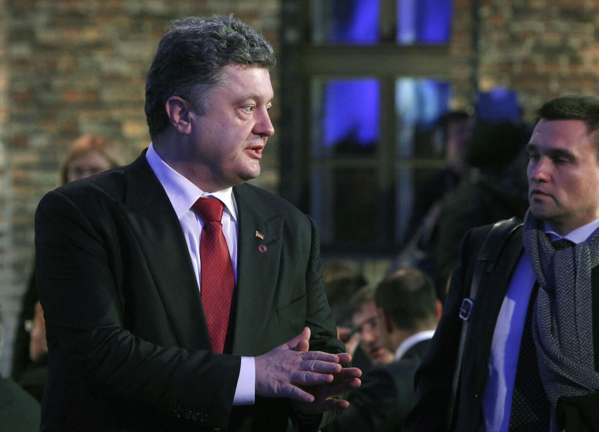 Ukrainian President Petro Poroshenko arrives in a tent raised at the entrance of the Birkenau Nazi death camp in Oswiecim, Poland, on Tuesday before the official remembrance ceremony.