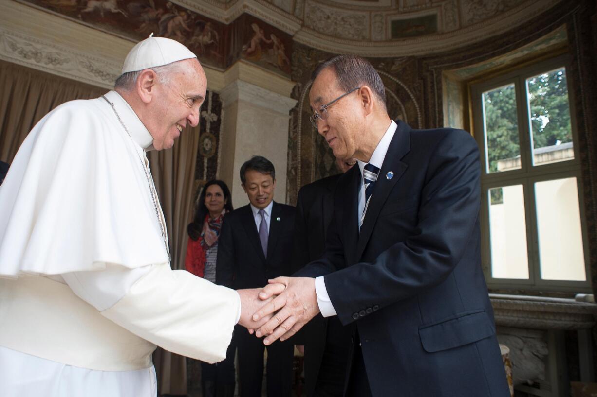 L'Osservatore Romano files
Pope Francis shakes hands with U.N. Secretary-General Ban Ki-moon on April 28 during their meeting at the Vatican. On Tuesday, Ban praised Pope Francis for framing climate change as an urgent moral imperative.