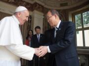 L'Osservatore Romano files
Pope Francis shakes hands with U.N. Secretary-General Ban Ki-moon on April 28 during their meeting at the Vatican. On Tuesday, Ban praised Pope Francis for framing climate change as an urgent moral imperative.