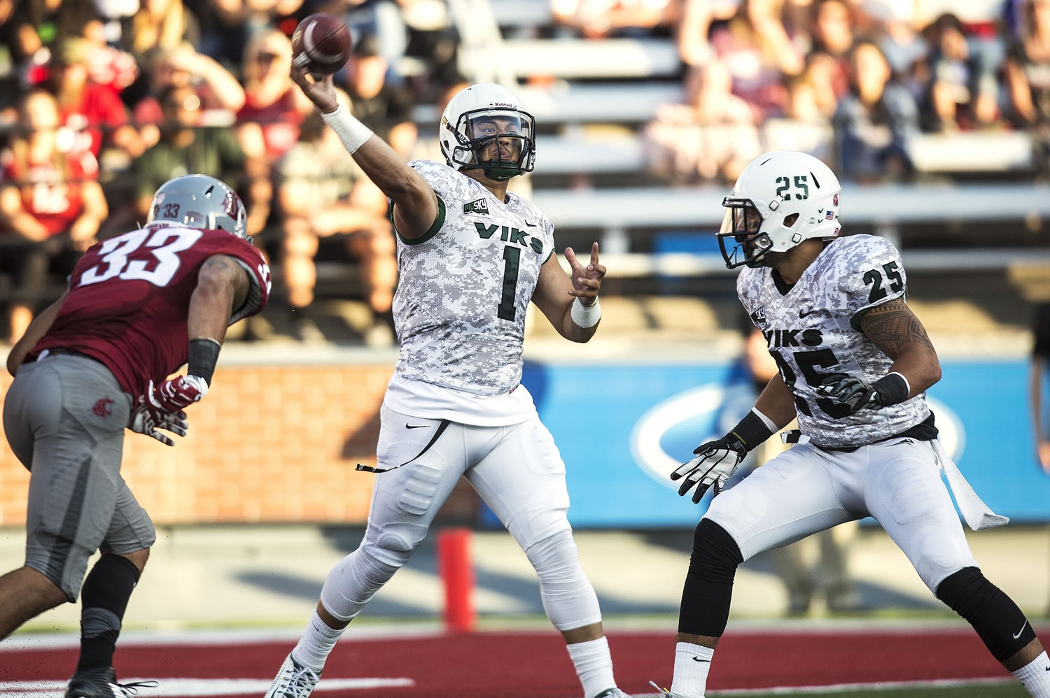 Portland State quarterback Kieran McDonagh (1), a Skyview High grad, throws under pressure from Washington State linebacker Tana Pritchard (33) during the second quarter Saturday.