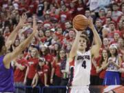 Gonzaga's Kevin Pangos (4) takes a shot against Portland's Alec Wintering during the second half Thursday, Jan. 29, 2015, in Spokane. Gonzaga won 64-46.