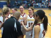 The Prairie girls basketball team huddles during its 3A bi-district playoff game against Lakes on Friday in Puyallup.