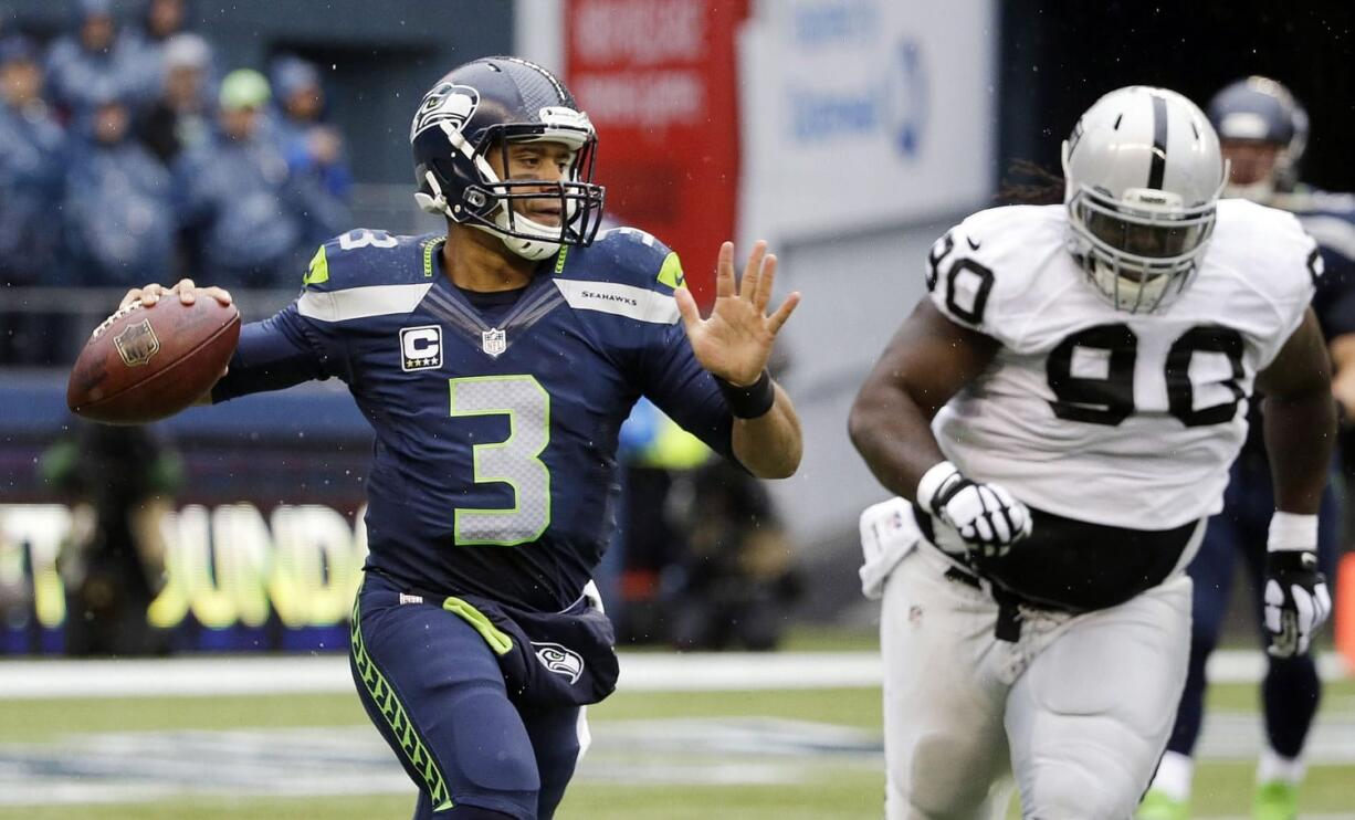 Seattle Seahawks quarterback Russell Wilson (3), is chased by Oakland Raiders' Pat Sims, acknowledged he did not play well at all in Sunday's game.