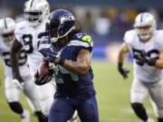 Seattle Seahawks running back Marshawn Lynch runs against the Oakland Raiders in the second half Sunday, Nov. 2, 2014, in Seattle. Lynch scored two touchdowns in the 30-24 win.