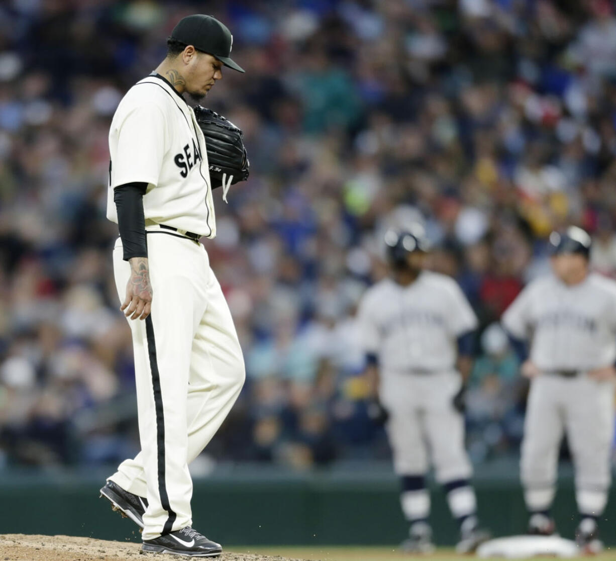 Seattle Mariners starting pitcher Felix Hernandez kicks at the dirt during the sixth inning, in which he gave up two runs to the Boston Red Sox on Saturday, May 16, 2015, in Seattle.