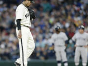 Seattle Mariners starting pitcher Felix Hernandez kicks at the dirt during the sixth inning, in which he gave up two runs to the Boston Red Sox on Saturday, May 16, 2015, in Seattle.