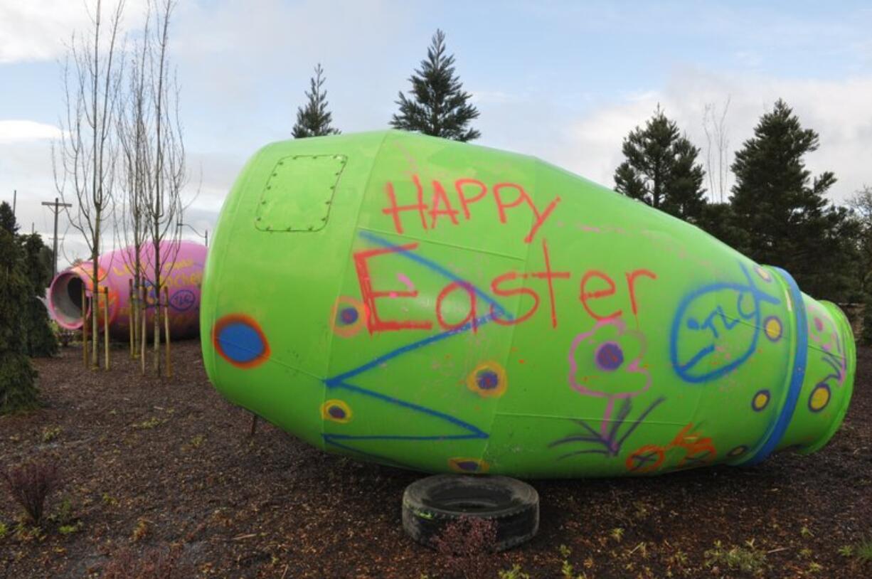 Cement truck cylinders painted as Easter eggs were mysteriously left in the Ridgefield roundabout Thursday.