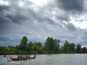 Dignitaries and members of the public paddle down Lake River to the Columbia River in 2012 during the Big Paddle event, which allowed them to learn about historical, cultural and environmental sites along the way.