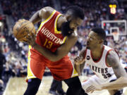 don ryan/Associated Press
Portland's Alonzo Gee, right, plays tight defense against Houston Rockets guard James Harden.