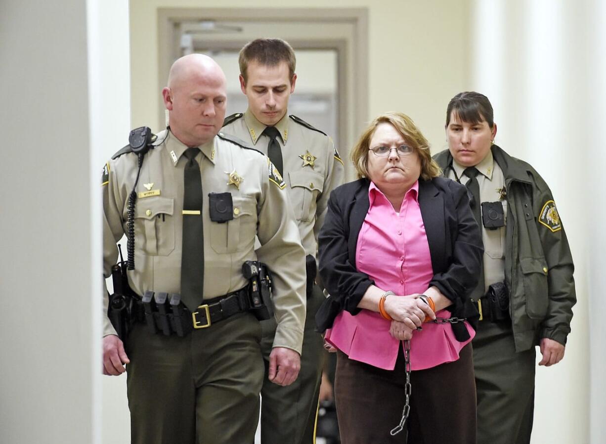 Found guilty of Capital Murder, Joyce Hardin Garrard is led back to the Etowah County Detention Center in Gadsden, Ala.