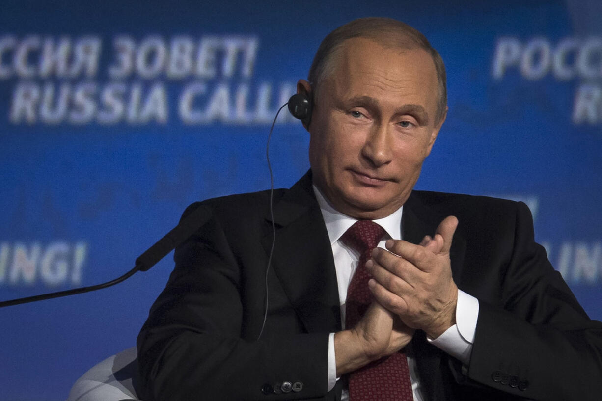 Russian President Vladimir Putin applauds during an investment conference Russia Calling in Moscow on Thursday.