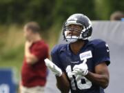 Seattle Seahawks' Tyler Lockett fields a kick during training camp Monday, Aug. 3, 2015, in Renton.