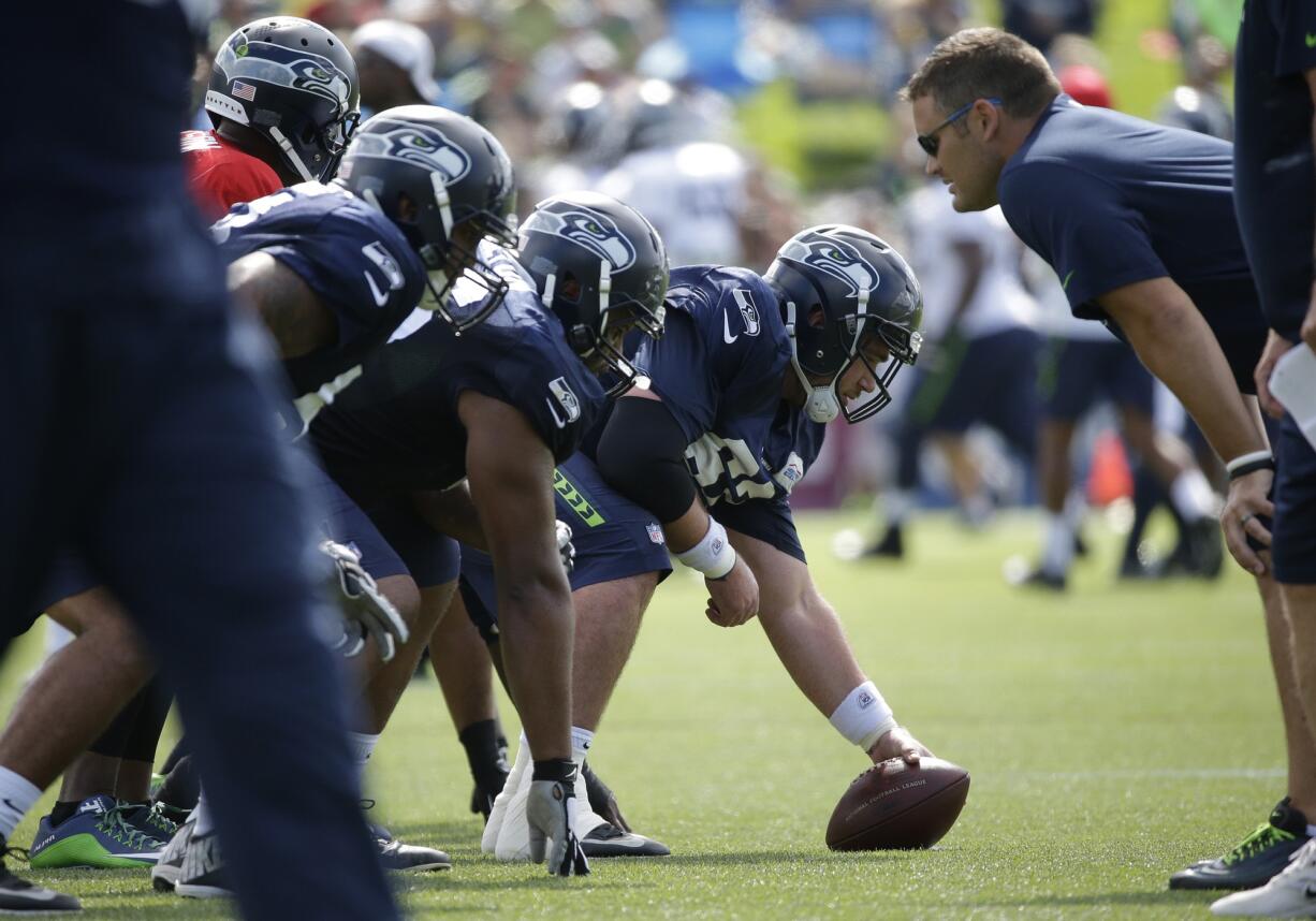 Seattle Seahawks center Drew Nowak gets ready to snap the ball during training camp Thursday, Aug. 6, 2015, in Renton.