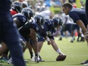 Seattle Seahawks center Drew Nowak gets ready to snap the ball during training camp Thursday, Aug. 6, 2015, in Renton.