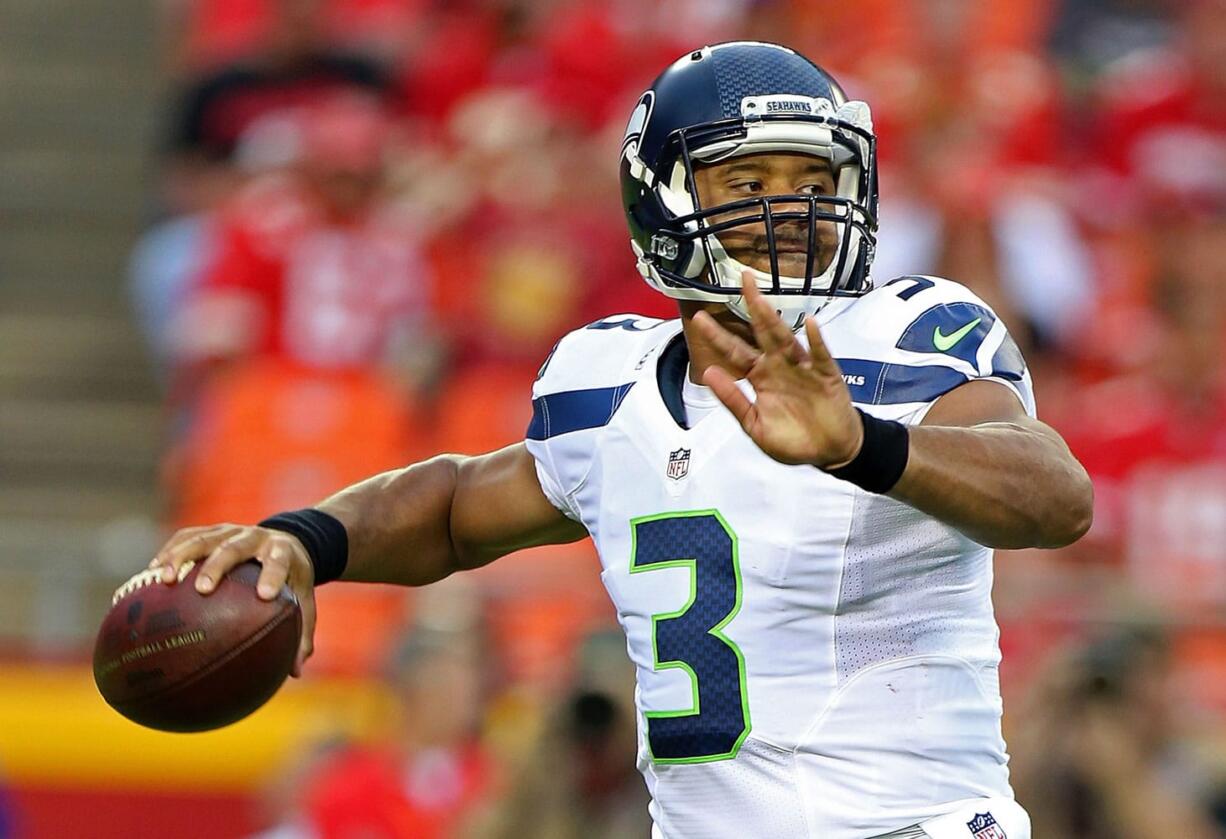 Seattle Seahawks quarterback Russell Wilson (3) throws a pass during an NFL preseason game against the Kansas City Chiefs on Friday Aug. 21, 2015 at Arrowhead Stadium in Kansas City, Mo.