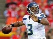 Seattle Seahawks quarterback Russell Wilson (3) throws a pass during an NFL preseason game against the Kansas City Chiefs on Friday Aug. 21, 2015 at Arrowhead Stadium in Kansas City, Mo.