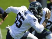 Seattle Seahawks rookie defensive end Frank Clark (55) runs a drill during NFL football rookie minicamp, Friday, May 8, 2015, in Renton.