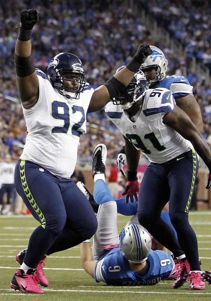 Seattle Seahawks defensive tackle Brandon Mebane (92) celebrates after sacking Detroit Lions quarterback Matthew Stafford (9) in the first half of an NFL football game on Sunday, Oct. 28, 2012, in Detroit.