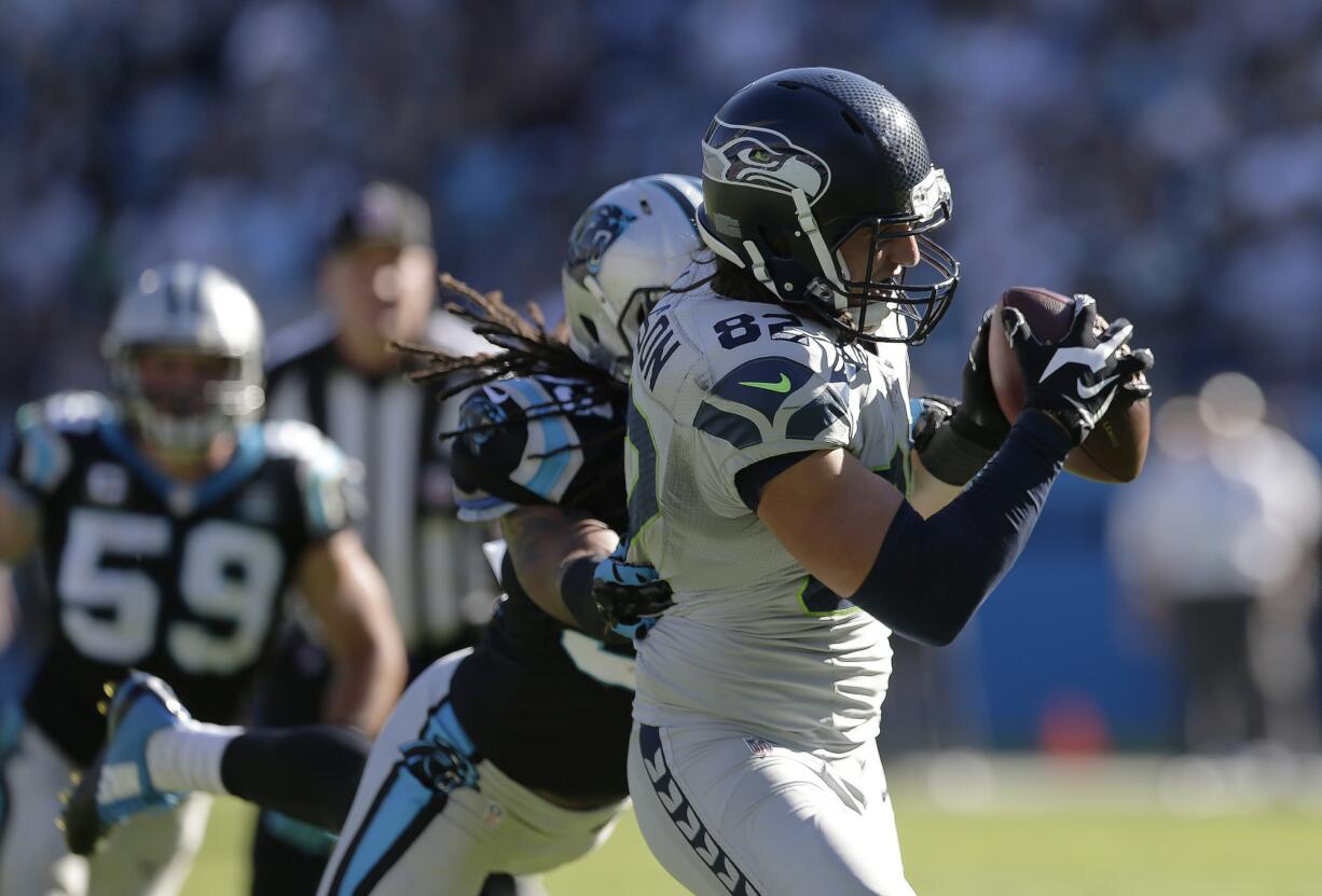 Carolina Panthers strong safety Tre Boston (33) tries to stop Seattle Seahawks tight end Luke Willson (82) as he makes the go-ahead touchdown catch in the fourth quarter Sunday, Oct.