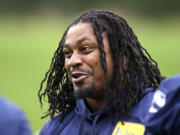 In this June 17 photo, Seattle Seahawks' Marshawn Lynch attends a football minicamp practice that he watched from the sidelines in Renton.