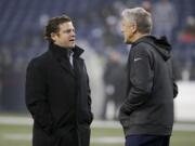 Seattle Seahawks general manager John Schneider, left, talking with head coach Pete Carroll.