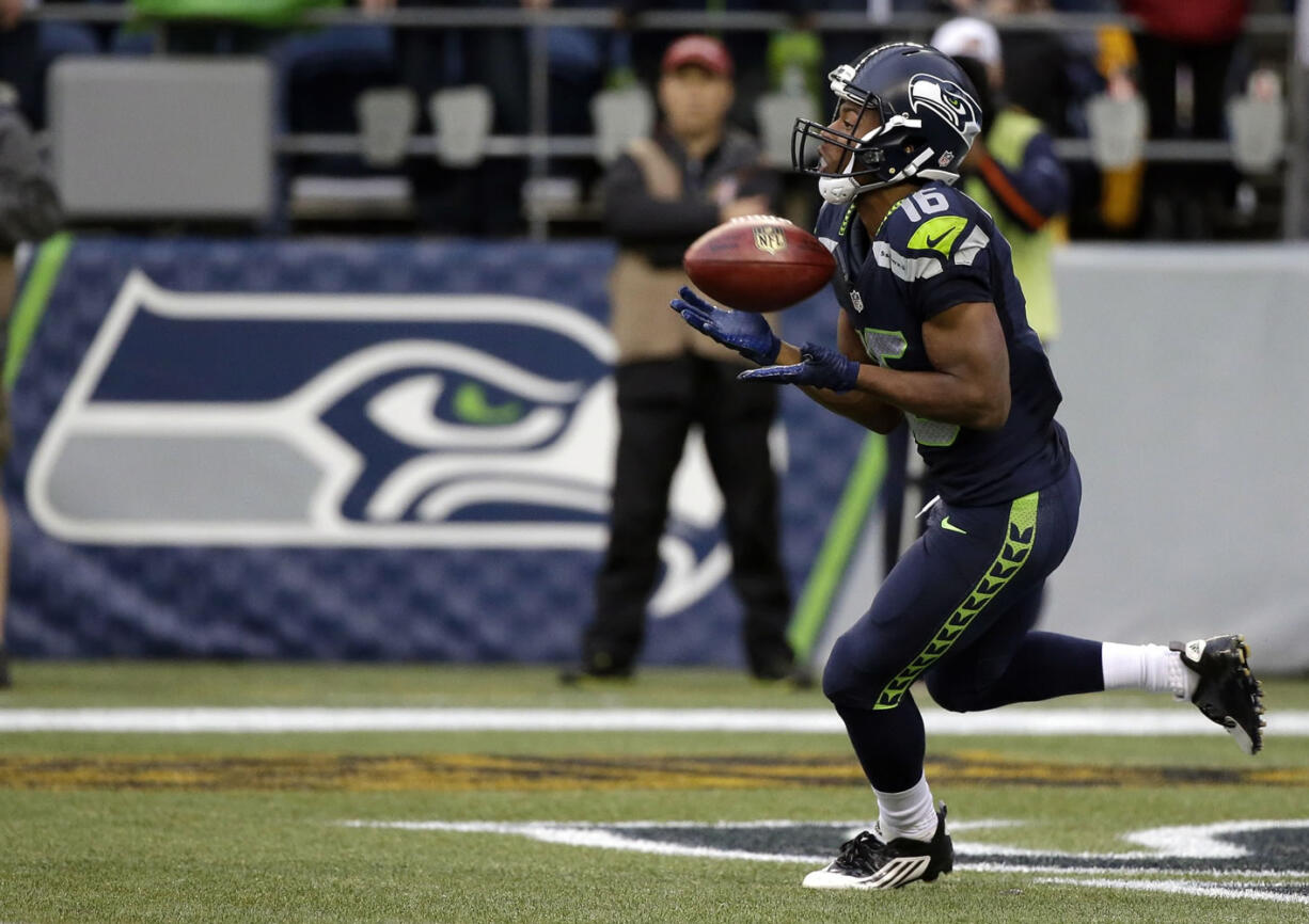 FILE - In this Aug. 14, 2015, file photo, Seattle Seahawks wide receiver Tyler Lockett begins his 103-yard kickoff return for a touchdown against the Denver Broncos in the first half of a preseason NFL football game in Seattle. All the concerns that emerged from Seattle's preseason opener were muted thanks to the standout performances from the Seahawks top two draft picks, defensive end Frank Clark and wide receiver Tyler Lockett.