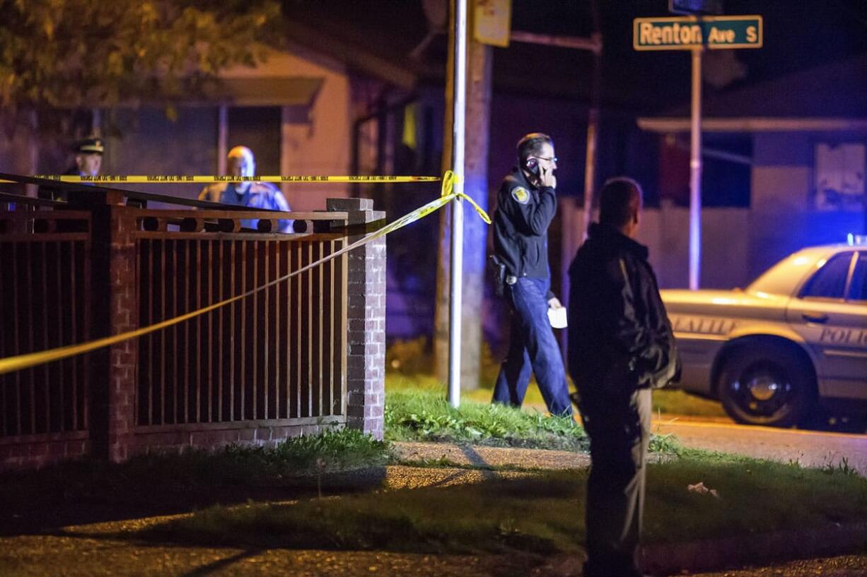 Seattle police work the scene of a murder/suicide in south Seattle on Monday.