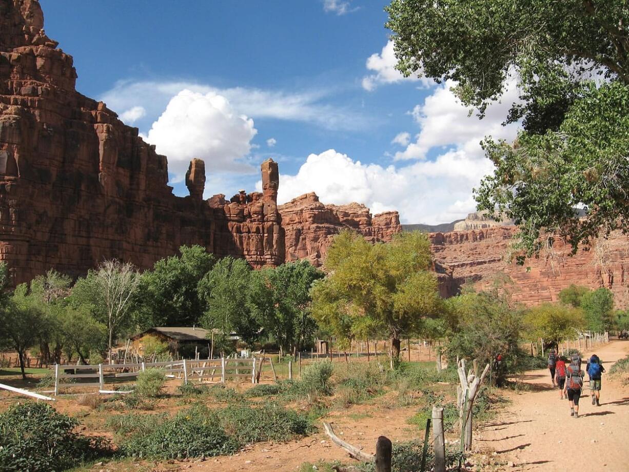 Hikers walk on a three-day round-trip hike in Havasu Canyon in northern Arizona.