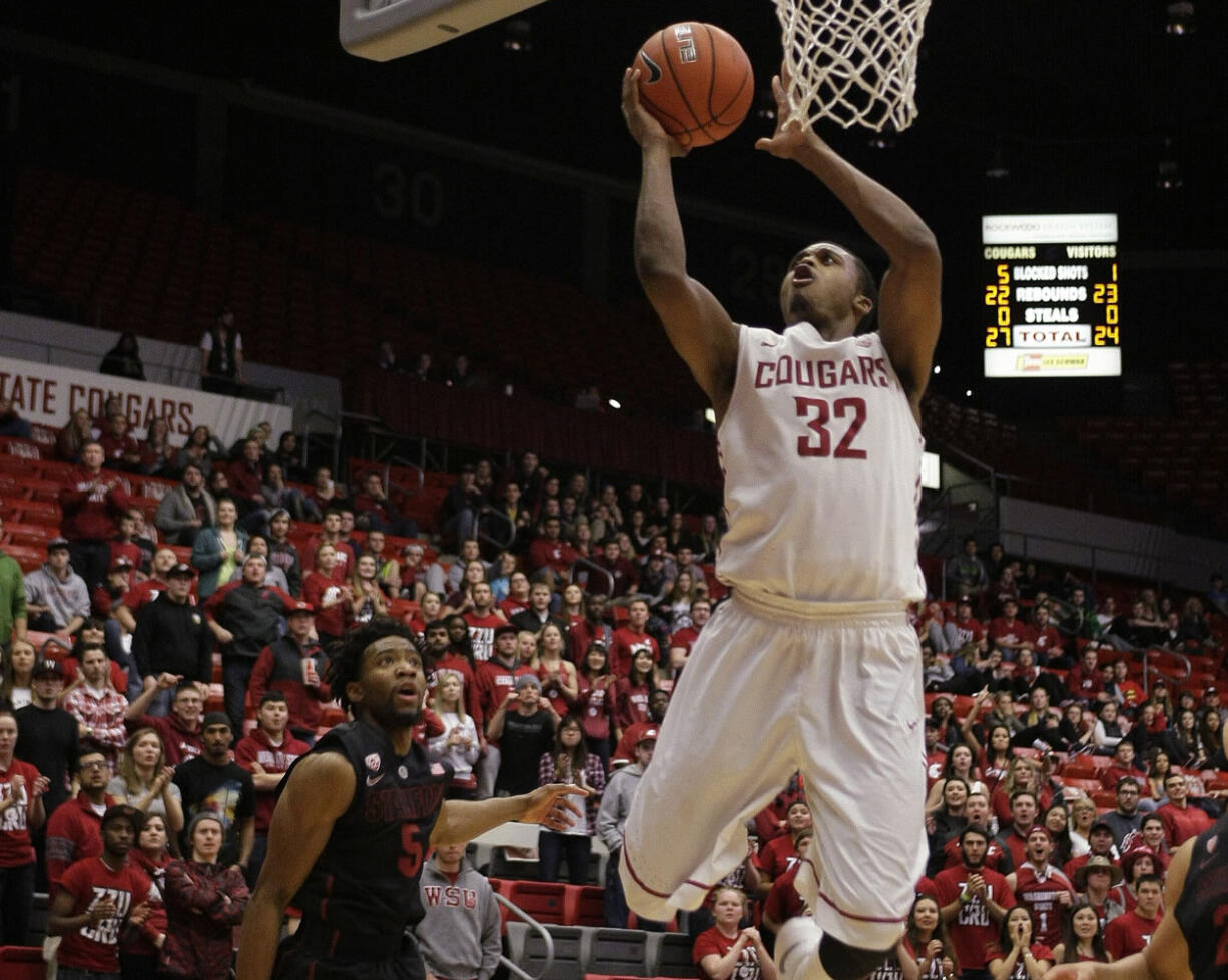 Washington State guard Que Johnson (32) drives to the basket past Stanford guard Chasson Randle (5) during the second half Saturday, January 31, 2015, in Pullman. Washington State won 89-88.