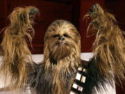 A yak hair and mohair costume of the Wookiee Chewbacca is displayed as part of an exhibit on the costumes of Star Wars at Seattle's EMP Museum.