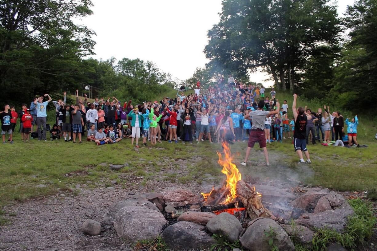 Frost Valley YMCA files
Campers at Camp Wawayanda sing songs around a bonfire in July in Claryville, N.Y. Prepping first-time campers for sleepaway or day programs can be tricky for parents.