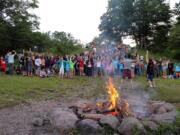 Frost Valley YMCA files
Campers at Camp Wawayanda sing songs around a bonfire in July in Claryville, N.Y. Prepping first-time campers for sleepaway or day programs can be tricky for parents.