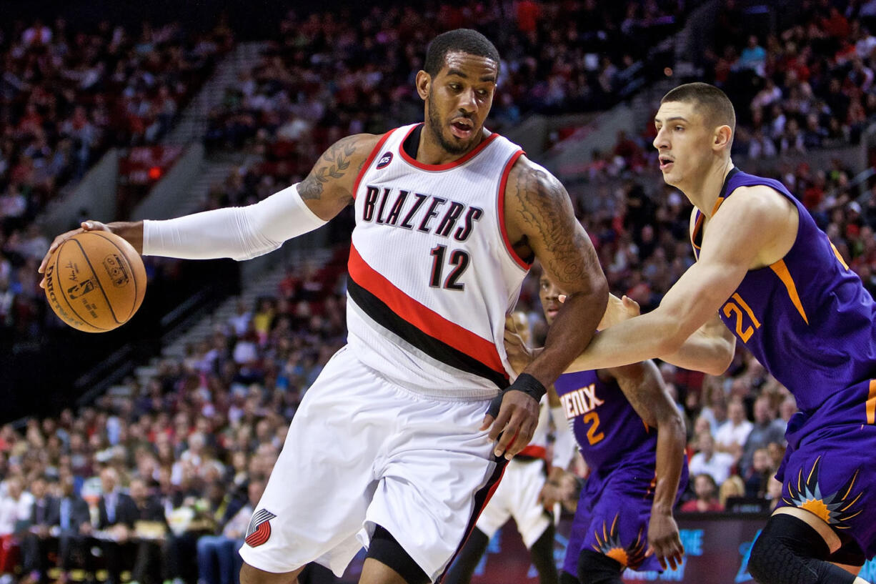 Portland Trail Blazers forward LaMarcus Aldridge, left, posts up Monday against Phoenix Suns center Alex Len, right, during the third quarter of an NBA basketball game in Portland.