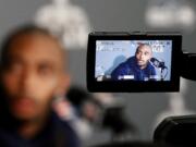 Seattle Seahawks' Doug Baldwin answers a question at a news conference for Super Bowl XLIX on Monday, Jan. 26, 2015, in Phoenix.