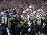 Seattle Seahawks outside linebacker Bruce Irvin (51), far left, gets into a brawl at the end of Super Bowl XLIX  against the New England Patriots on Sunday, Feb. 1, 2015, in Glendale, Ariz.