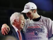 New England Patriots quarterback Tom Brady, right, celebrates with owner Robert Kraft after the NFL Super Bowl XLIX football game against the Seattle Seahawks on Sunday in Glendale, Ariz.