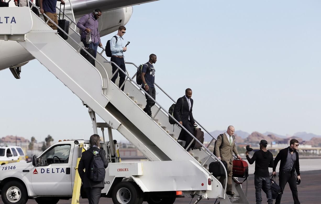 Seattle Seahawks players arrive at Sky Harbor Airport for NFL Super Bowl XLIX football game Sunday in Phoenix. The Seahawks play the New England Patriots in Super Bowl XLIX on Sunday, Feb.