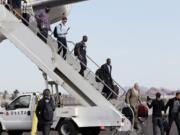 Seattle Seahawks players arrive at Sky Harbor Airport for NFL Super Bowl XLIX football game Sunday in Phoenix. The Seahawks play the New England Patriots in Super Bowl XLIX on Sunday, Feb.