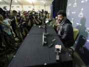 Seattle Seahawks' Russell Wilson answers a question at a news conference after arriving for Super Bowl XLIX on Sunday, Jan. 25, 2015, in Phoenix. The Seahawks play the New England Patriots on Sunday, Feb.