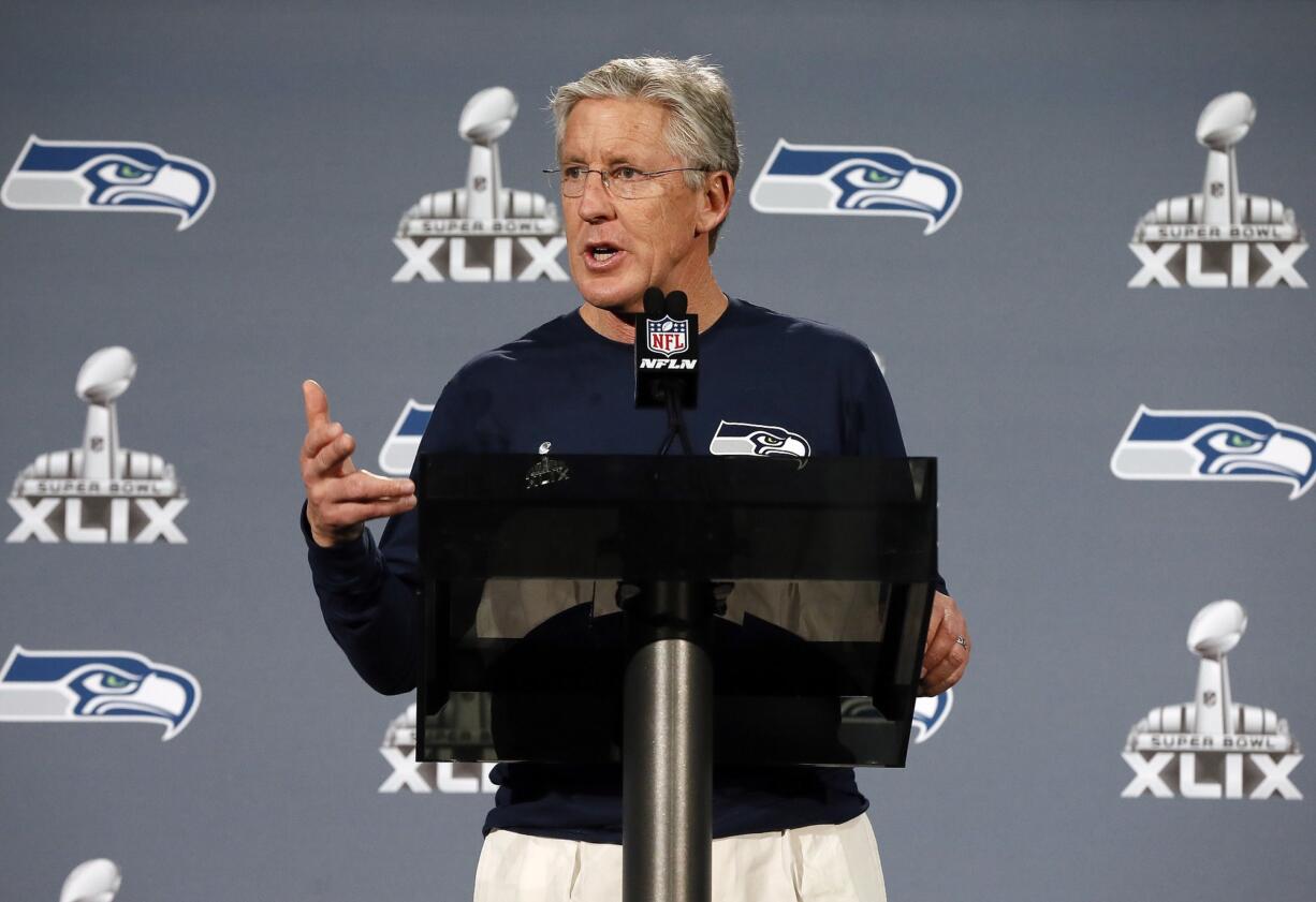 Seattle coach Pete Carroll answers a question during his Monday news conference.