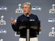 Seattle coach Pete Carroll answers a question during his Monday news conference.