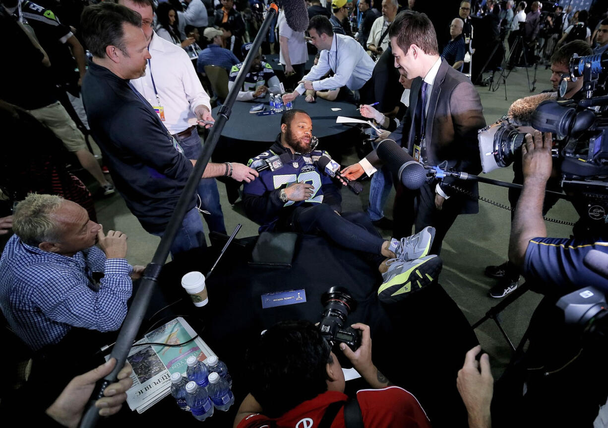 Seattle Seahawks defensive lineman Michael Bennett kicks back during Wednesday's media session.