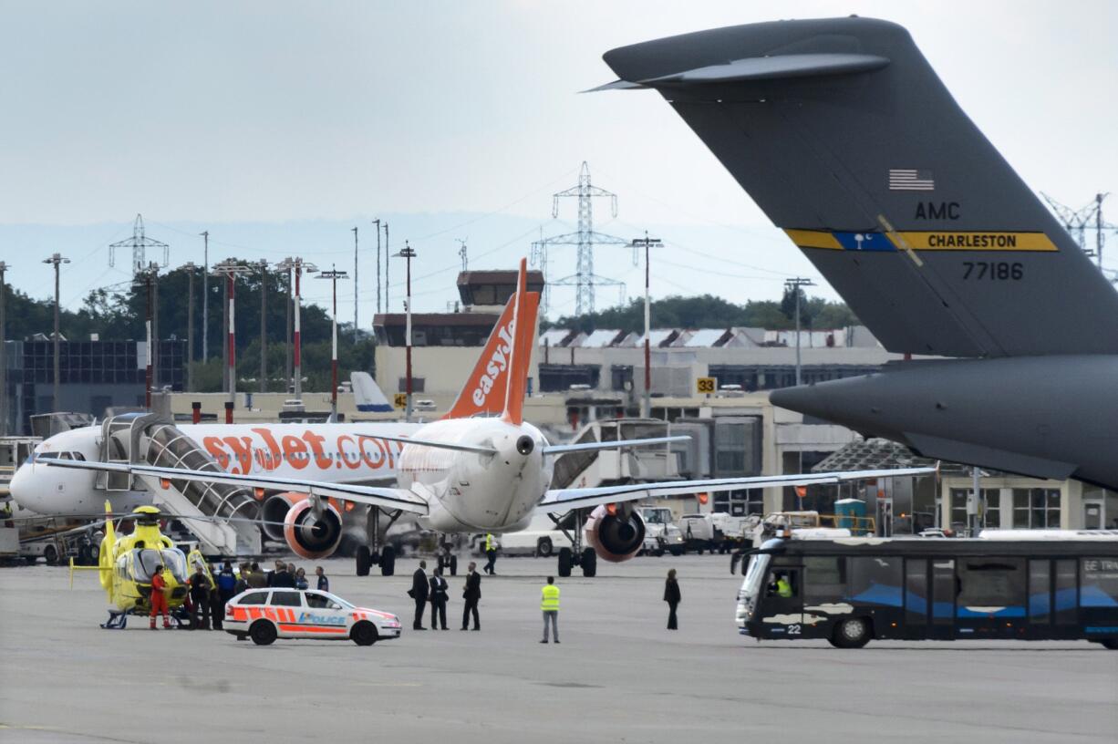 U.S. Secretary of State John Kerry is carried out of a medical helicopter to board a US military C-17 transport aircraft, at Geneva Airport, Switzerland, on Monday. Kerry, 71, fractured his right femur Sunday when he struck a curb with his bicycle and fell on a regular Tour de France route near Geneva. He has been receiving treatment at Geneva's main medical center, HUG.