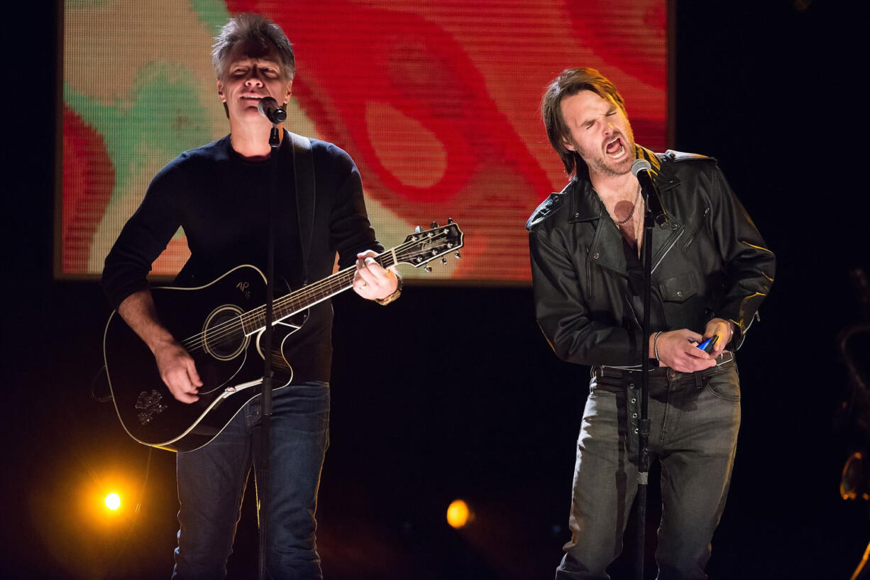 Jon Bon Jovi, left, and Will Forte perform at Comedy Central's &quot;Night of Too Many Stars: America Comes Together for Autism Programs&quot; at the Beacon Theatre in New York.